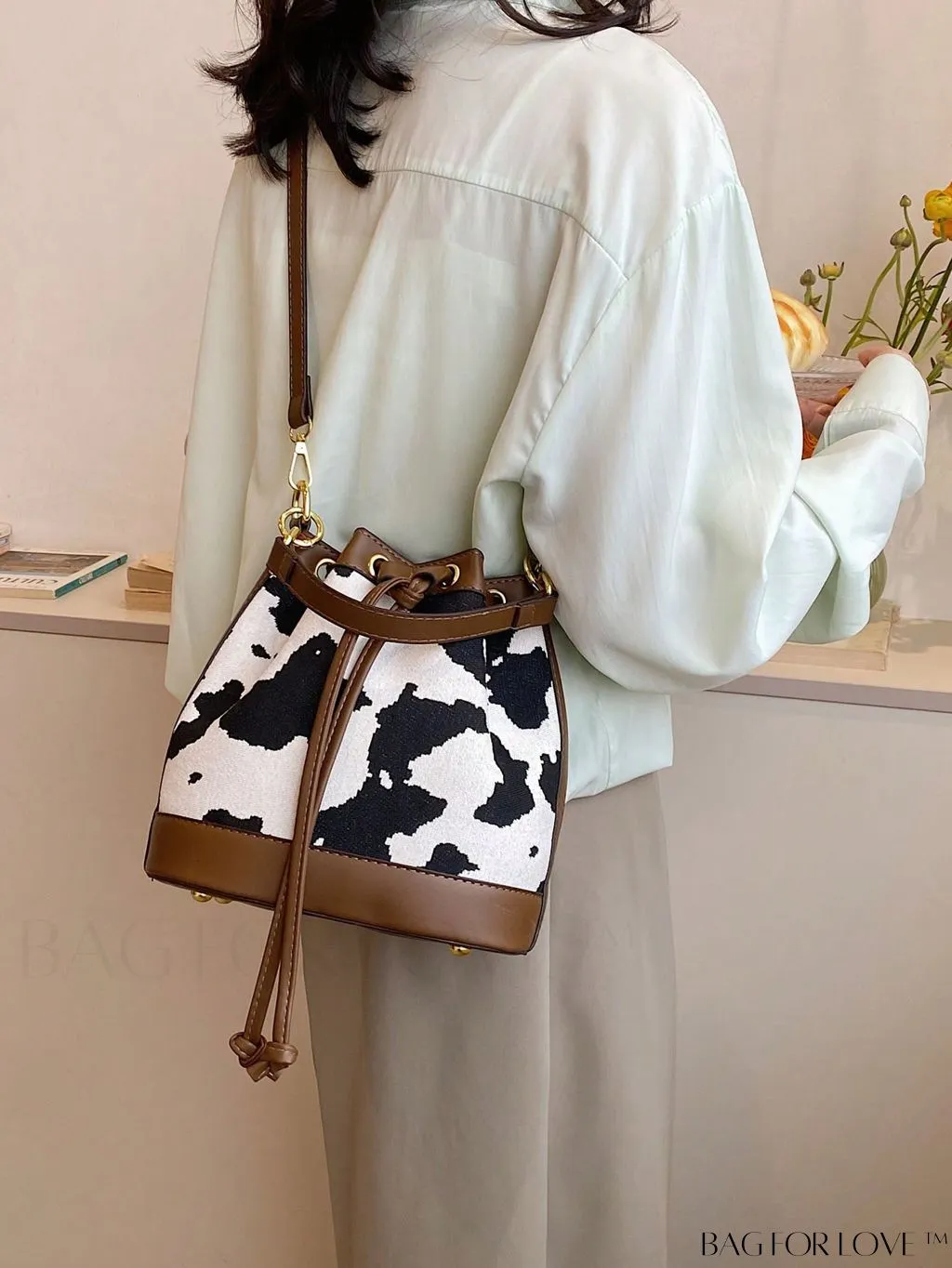 BagForLove - Stylish Cow Pattern Colorblock Bucket Bag with Drawstring - Captivating Design